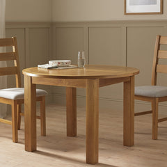 Round oak dining table with natural oak tabletop and legs
