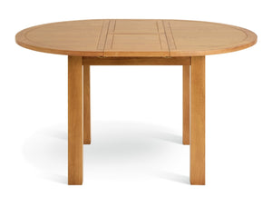 Compact round oak table ideal for everyday family dining
