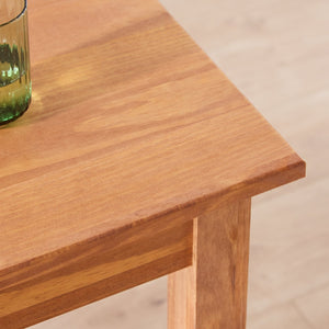 Solid wood dining set with matching wooden chairs
