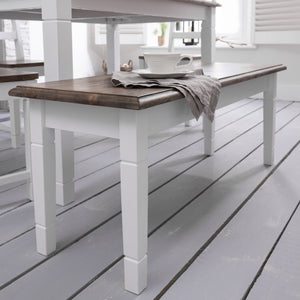 A Canterbury bench with a white frame and dark pine wood top, placed on a wooden floor.