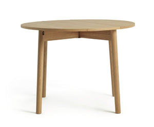 Foldable dining table in natural finish for compact homes